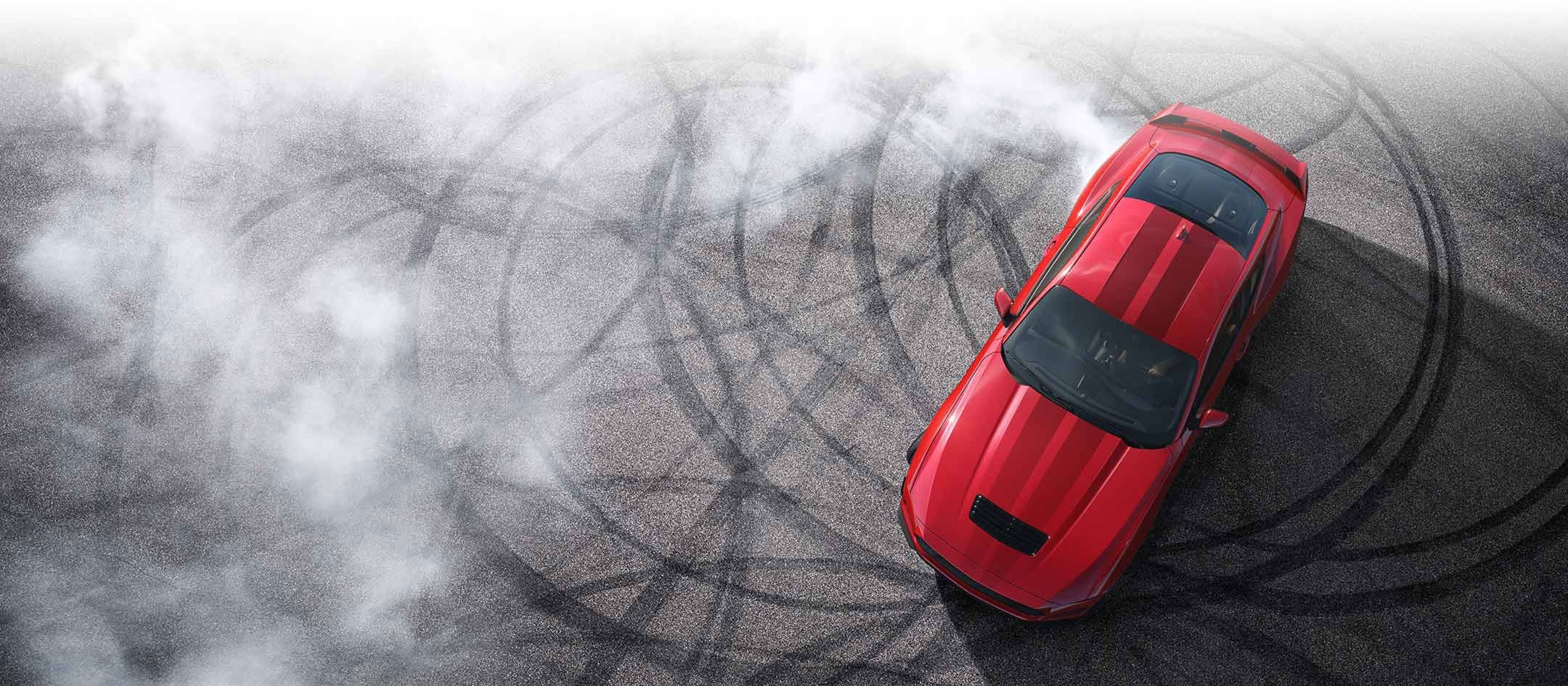 Overhead view of a 2024 Ford Mustang® model with tire tracks on pavement | Dick's Canby Ford in Canby OR